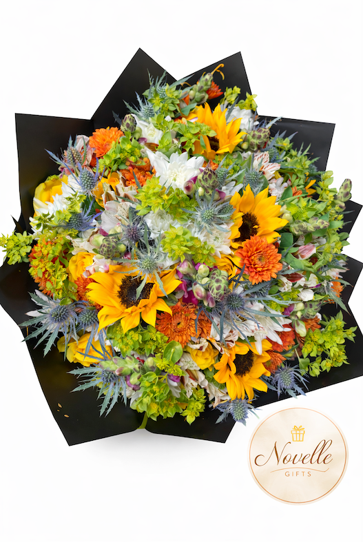 Bouquet of Sunflowers and other flowers with a black wrap and card